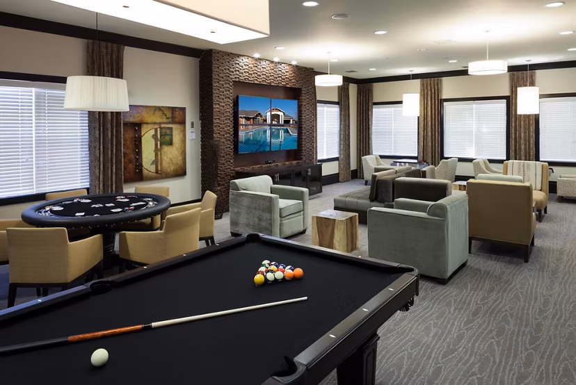Clubhouse featuring modern design and cozy seating at River Oaks Apartments