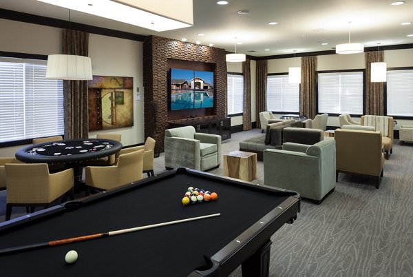 Clubhouse featuring modern design and cozy seating at River Oaks Apartments