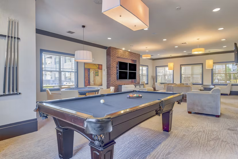 Clubhouse with stylish seating and modern decor at River Oaks Apartments, featuring a sophisticated luxury setting