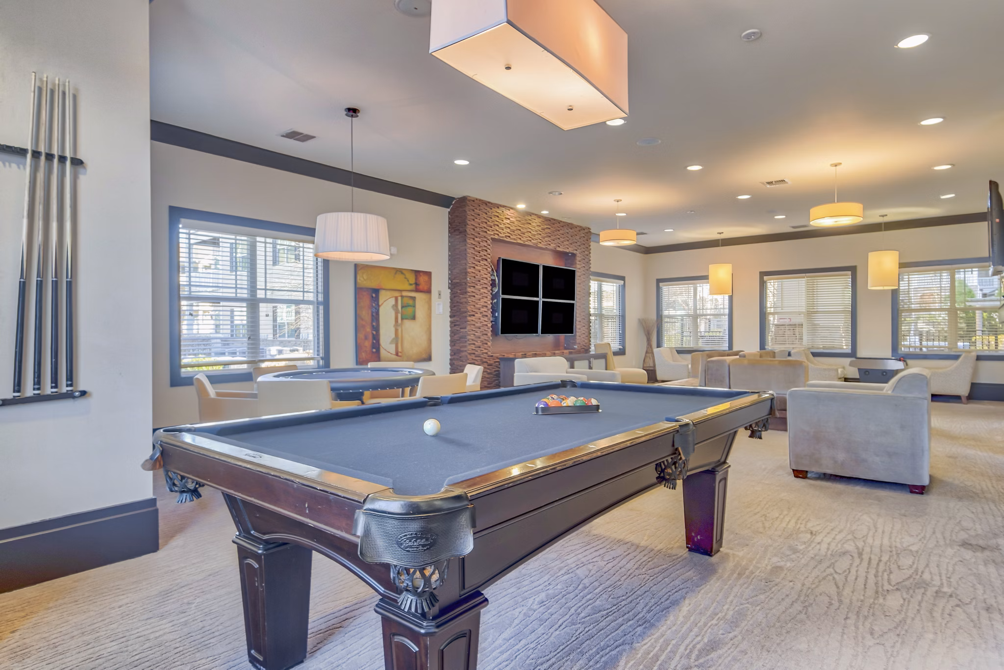 Clubhouse with stylish seating and modern decor at River Oaks Apartments, featuring a sophisticated luxury setting