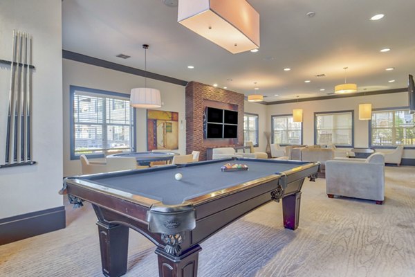 Clubhouse with stylish seating and modern decor at River Oaks Apartments, featuring a sophisticated luxury setting