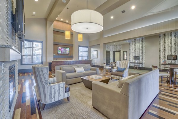 Clubhouse with modern furnishings and pool table at River Oaks Apartments luxury apartments in Woodbridge, VA.