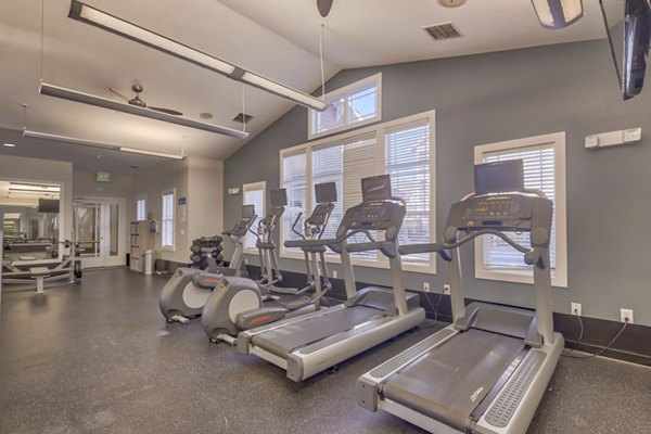 State-of-the-art fitness center with modern equipment at River Oaks Apartments Perfect for health enthusiasts seeking luxury living