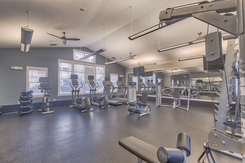 State-of-the-art fitness center with modern equipment at River Oaks Apartments