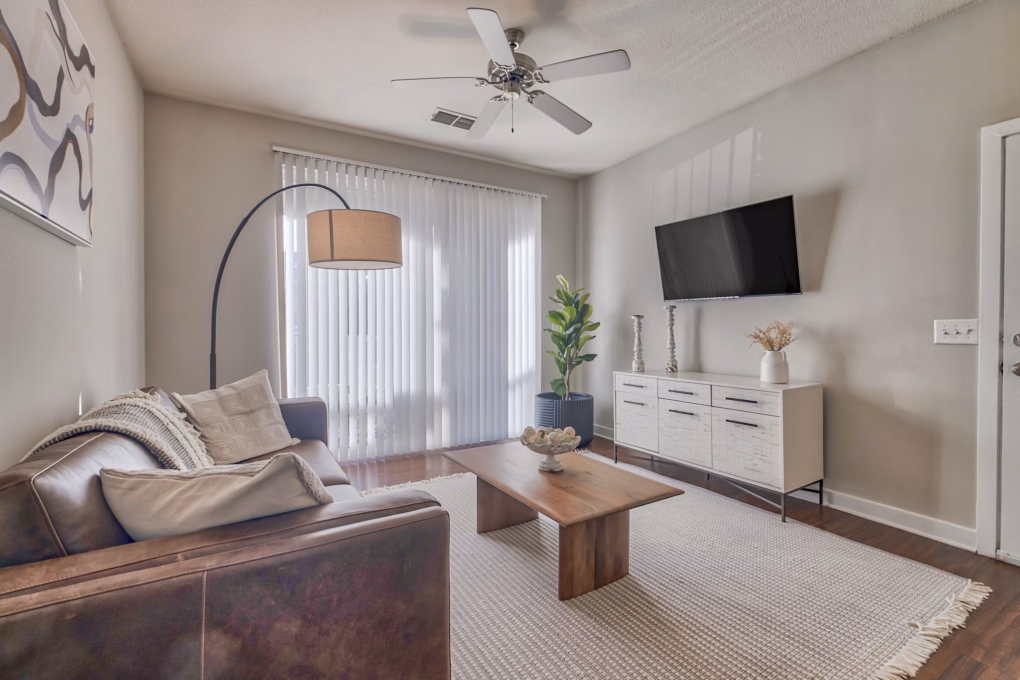 Spacious living room with elegant furnishings in River Oaks Apartments luxury residences