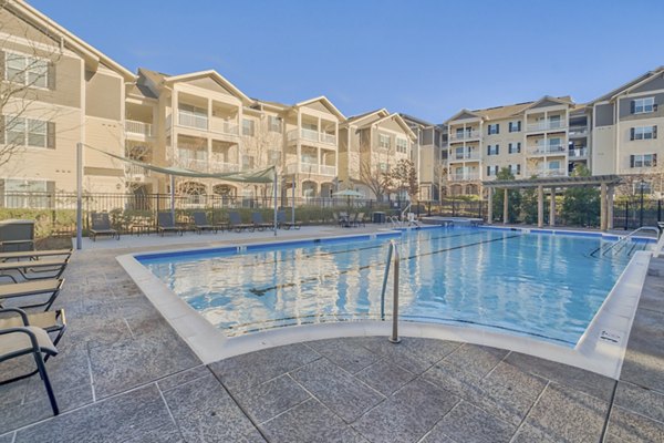 Poolside oasis at River Oaks Apartments featuring a serene setting and luxury amenities