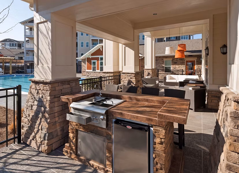 Outdoor grill area with modern design at River Oaks Apartments