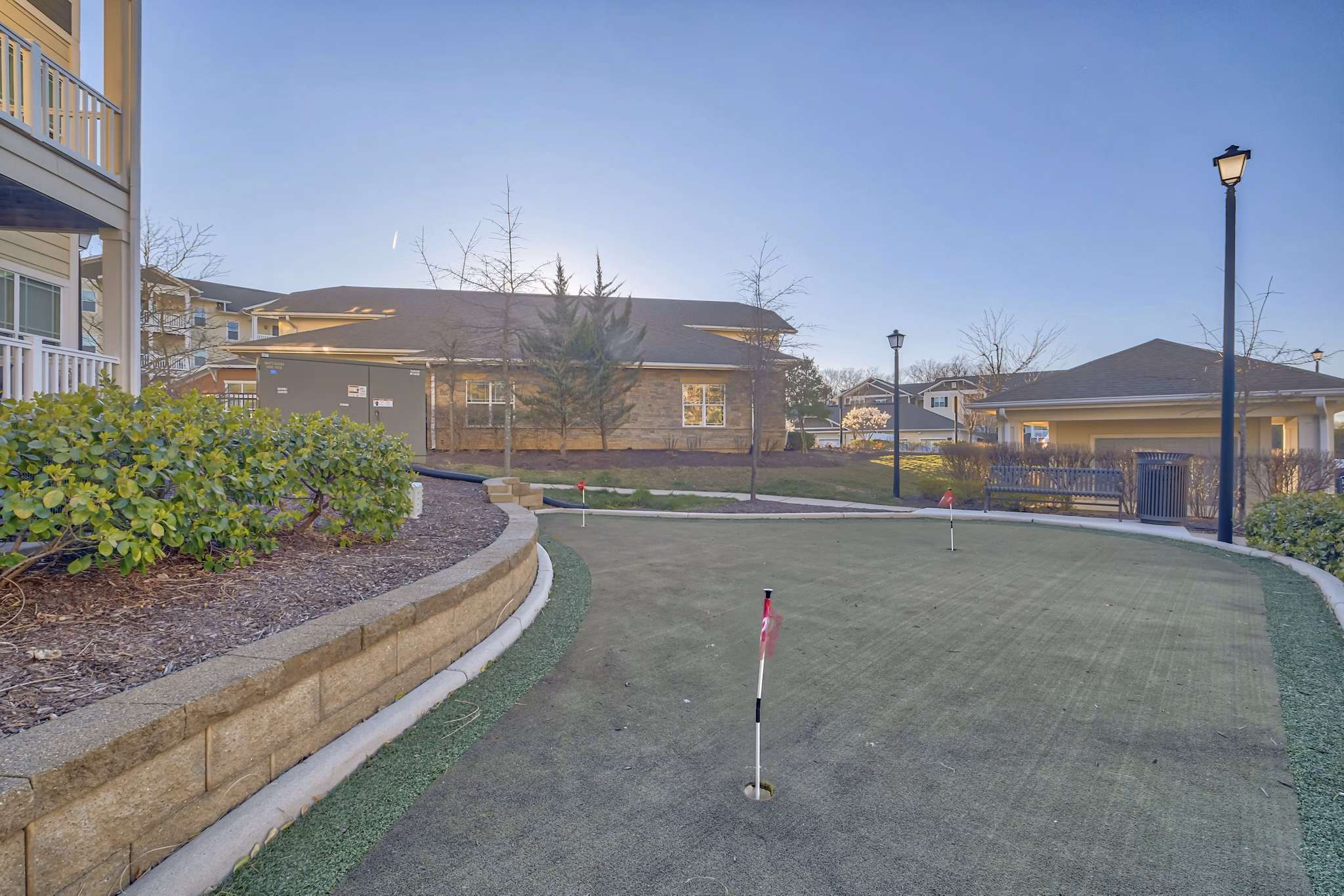 Outdoor sport court with basketball hoops at River Oaks Apartments, ideal for recreational activities and fitness enthusiasts