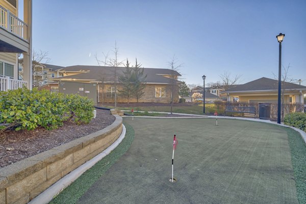 Outdoor sport court with basketball hoops at River Oaks Apartments, ideal for recreational activities and fitness enthusiasts