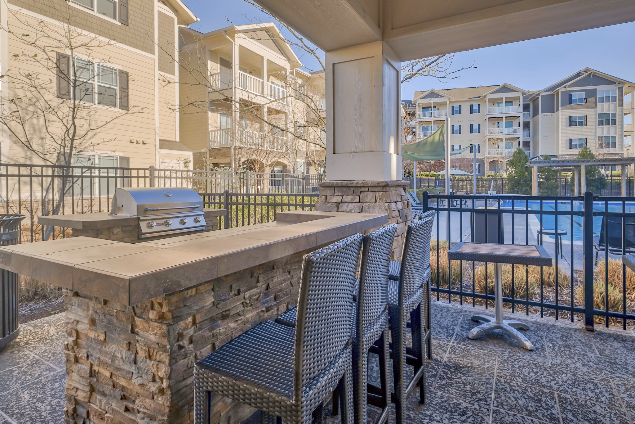 Outdoor grill area with modern amenities at River Oaks Apartments