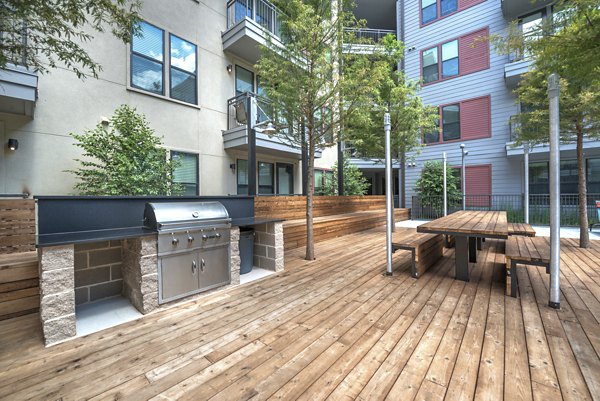 Grill area with modern seating at Eastbank at Waterside Apartments offering outdoor leisure spaces