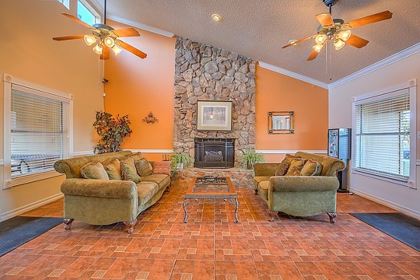 Modern clubhouse with open lounge areas at Arrowhead Pointe Apartments, a Greystar community