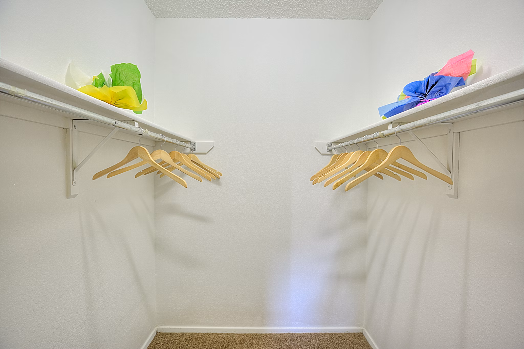 Walk-in closet with built-in shelving at Arrowhead Pointe Apartments