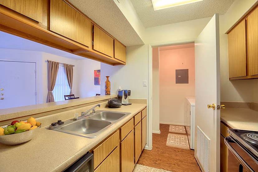 Modern kitchen with stainless steel appliances at Arrowhead Pointe Apartments