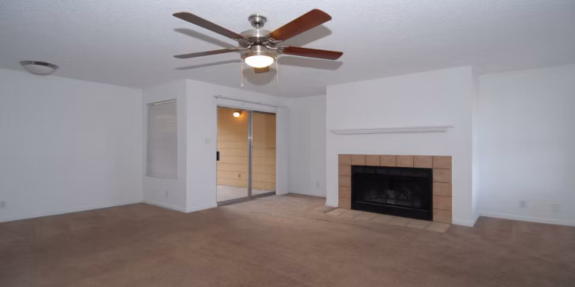 Spacious living room with modern furnishings at Arrowhead Pointe Apartments, ideal for luxury living