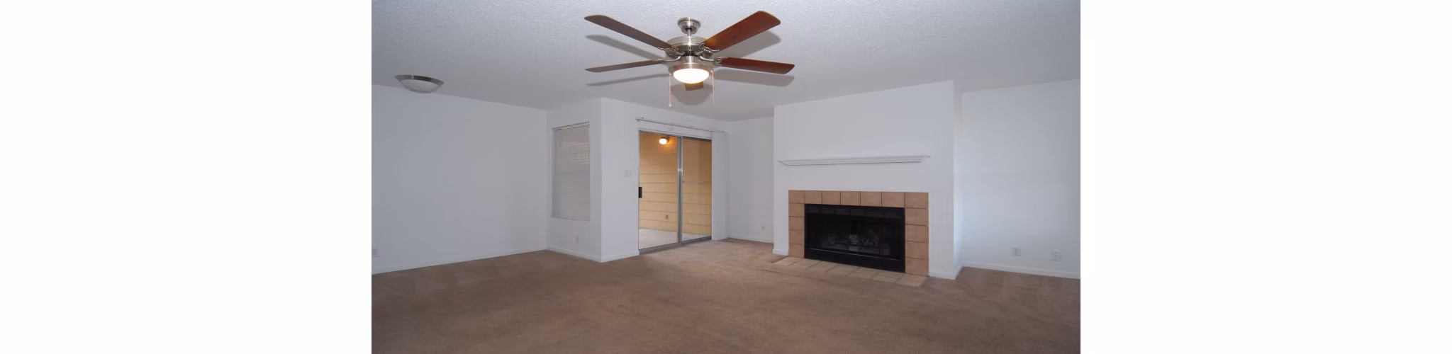 Spacious living room with modern furnishings at Arrowhead Pointe Apartments, ideal for luxury living