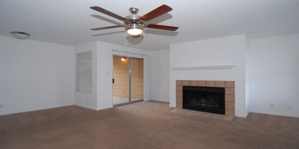 Spacious living room with modern furnishings at Arrowhead Pointe Apartments, ideal for luxury living