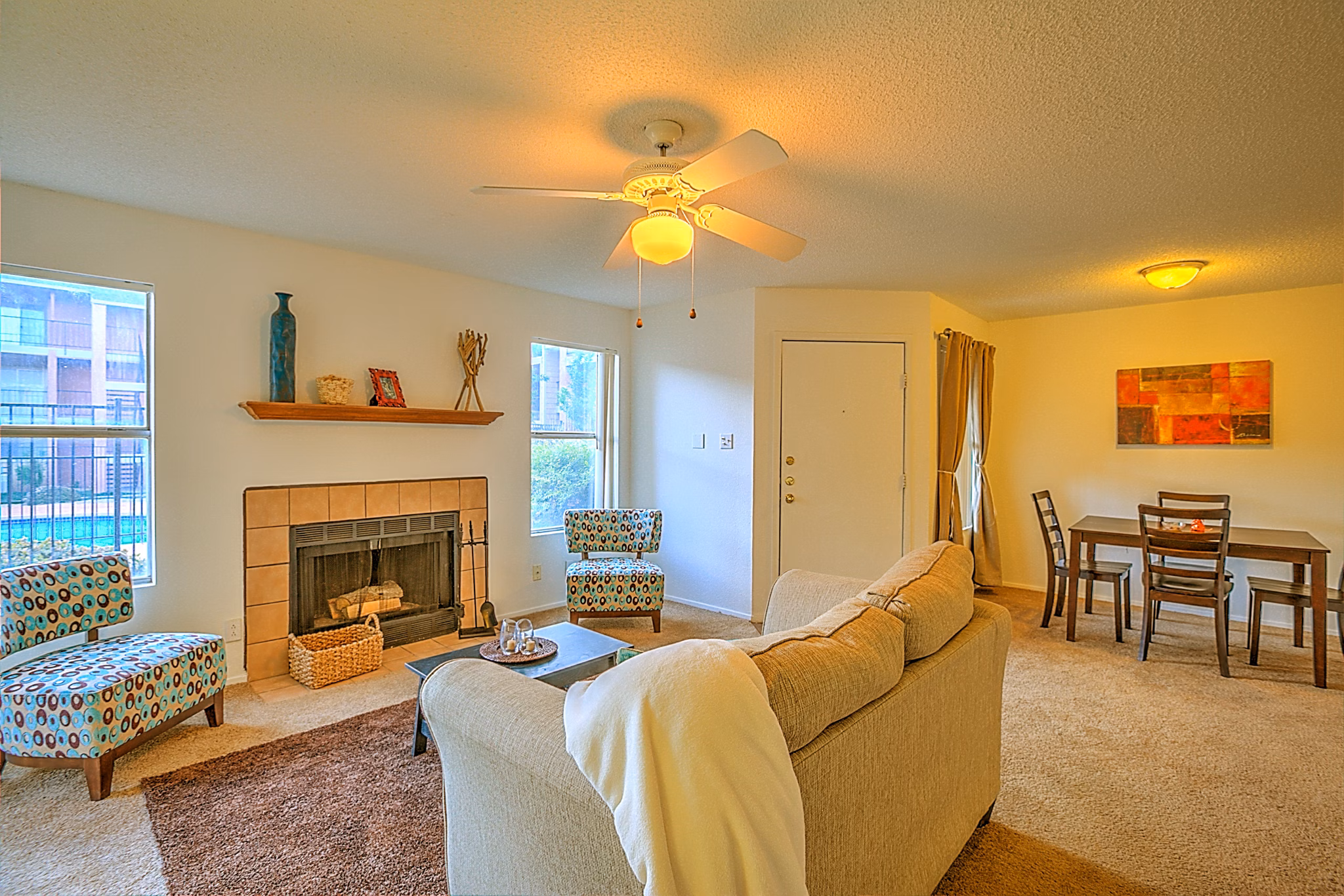 Spacious living room with modern furnishings at Arrowhead Pointe Apartments in Greystar community