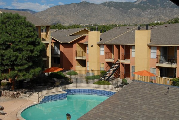 Inviting poolside lounging area at Arrowhead Pointe Apartments offering luxury relaxation and amenities