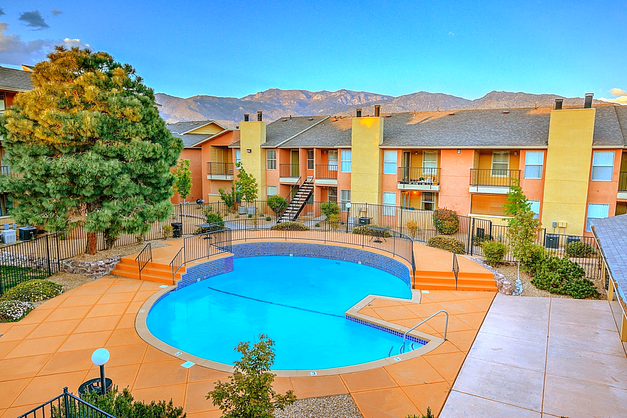 Outdoor swimming pool with lounge chairs at Arrowhead Pointe Apartments in a serene setting Perfect for relaxation and socializing