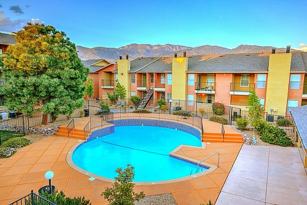 Outdoor swimming pool with lounge chairs at Arrowhead Pointe Apartments in a serene setting Perfect for relaxation and socializing