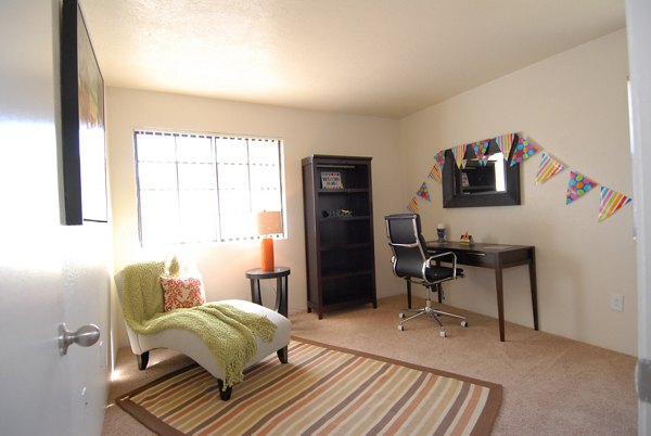 Entrada Pointe Apartments: Elegant bedroom with modern decor and king-sized bed