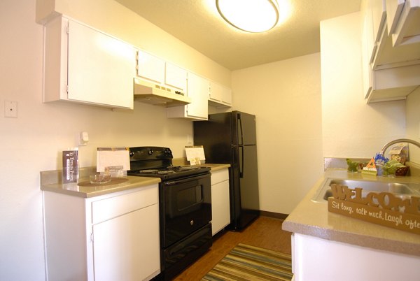 Modern kitchen with stainless steel appliances at Entrada Pointe Apartments
