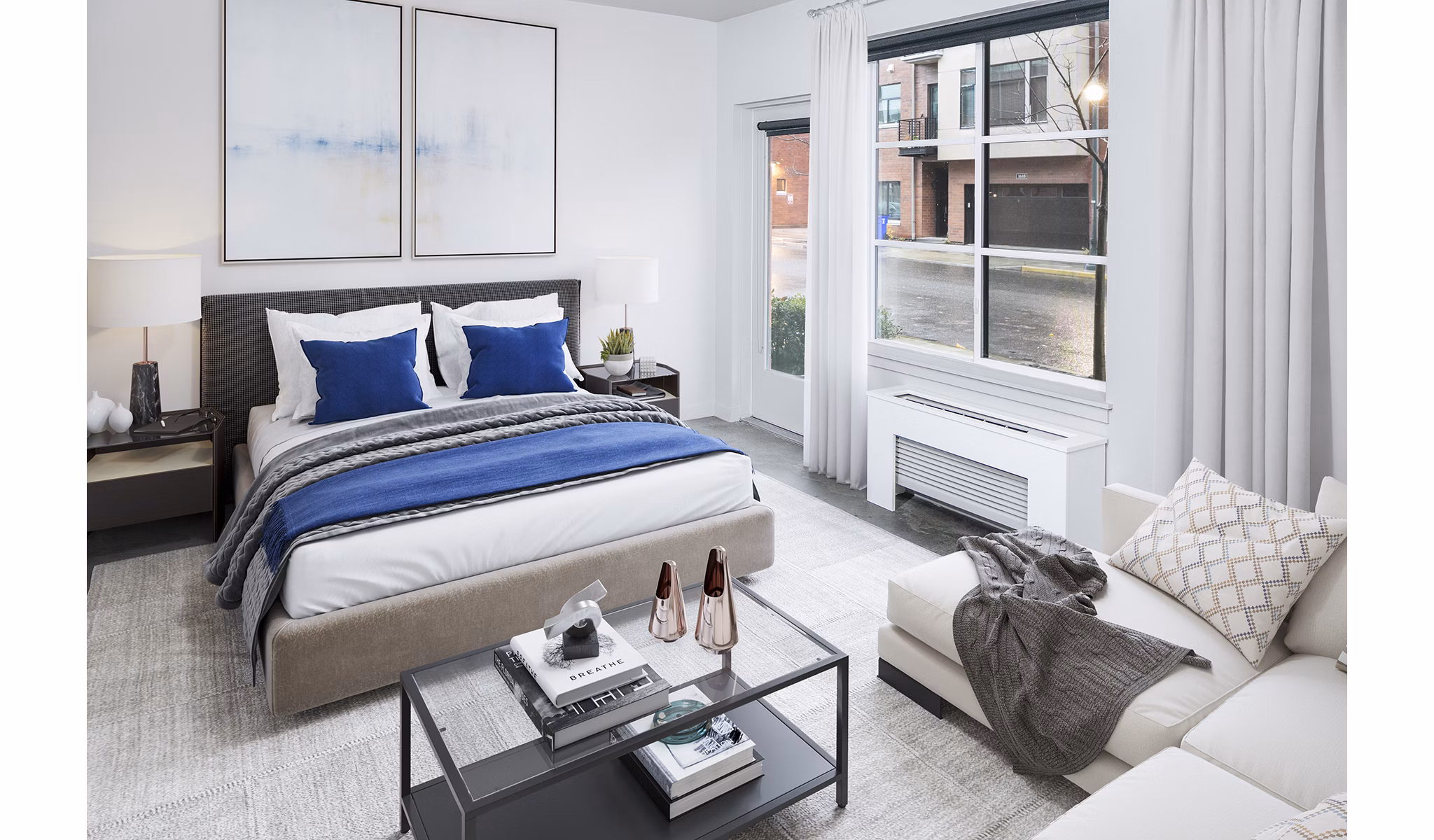 Tranquil bedroom with modern furnishings at Waterline Apartments, featuring floor-to-ceiling windows for natural light