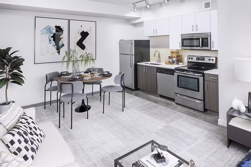 Dining room featuring modern decor and elegant lighting at Waterline Apartments
