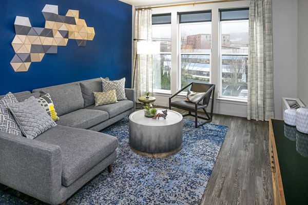 Spacious living room with contemporary furniture in Waterline Apartments, perfect for luxury urban living