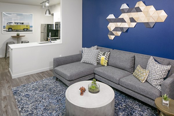 Spacious living room with contemporary furnishings in Waterline Apartments, offering luxury living in a prime city location