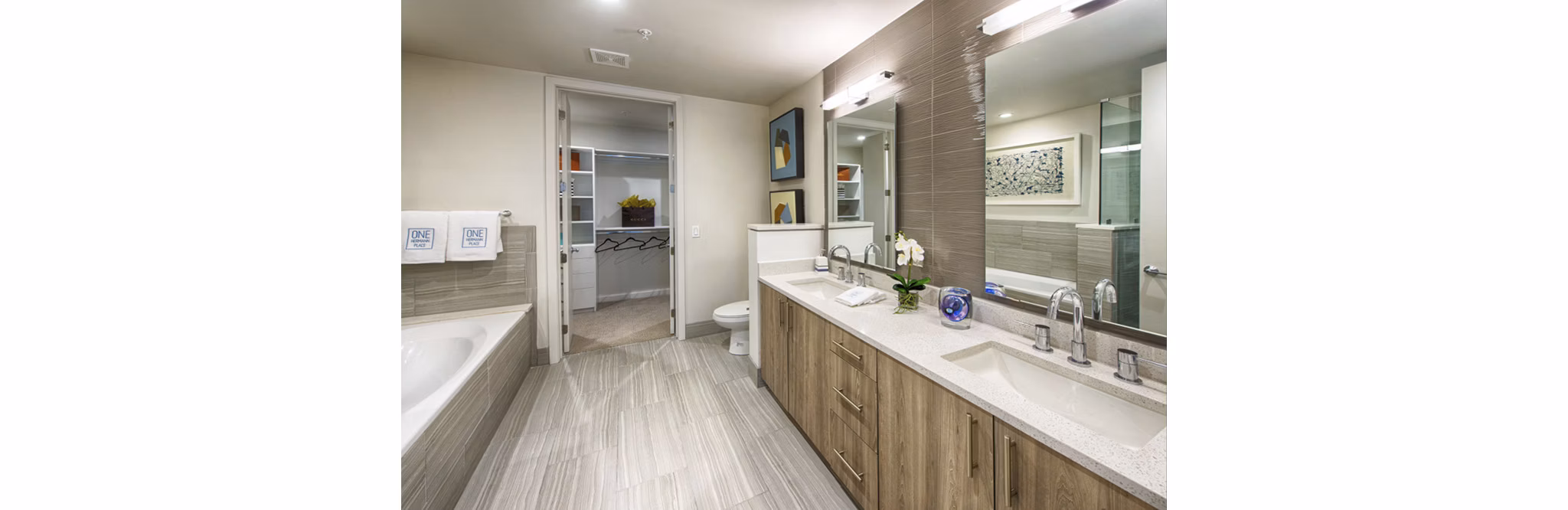 Modern bathroom with sleek fixtures at One Hermann Place Apartments, Houston's luxury living community