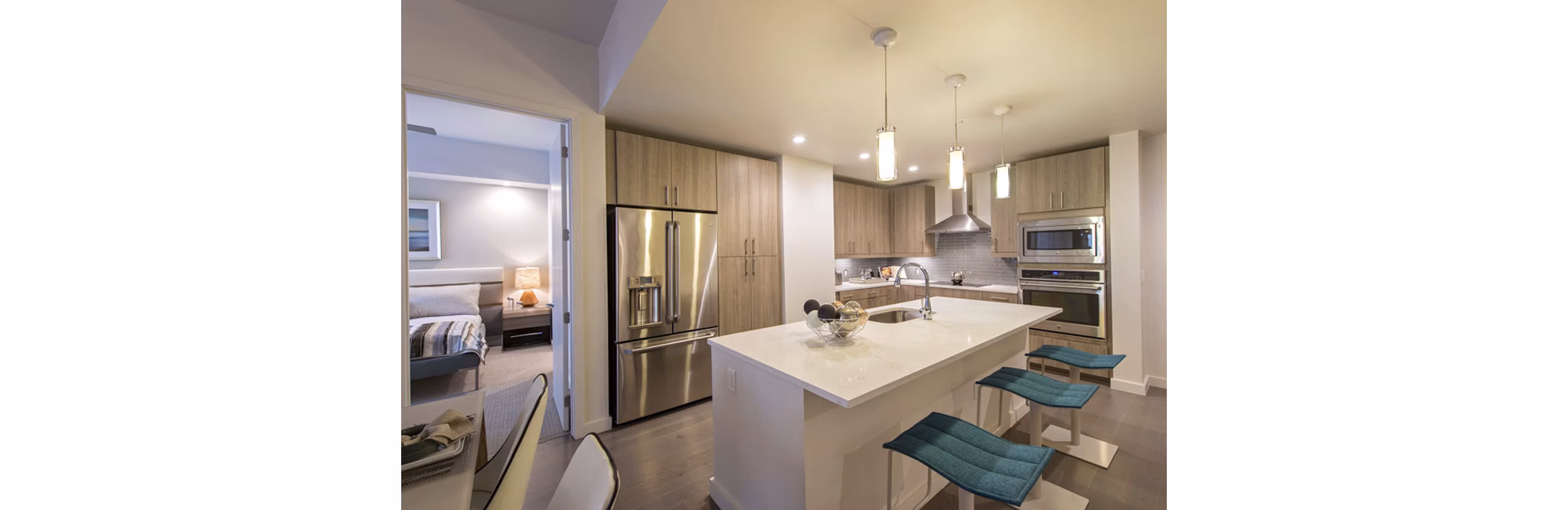 Modern kitchen with stainless steel appliances at One Hermann Place Apartments