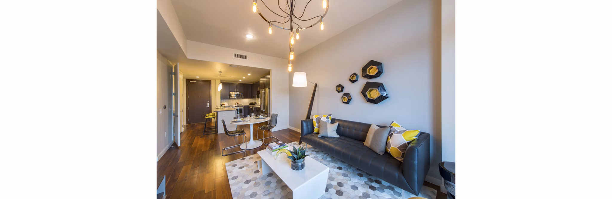 Spacious living room with modern decor at One Hermann Place Apartments
