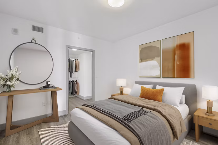 Cozy bedroom with modern decor at Adaire Apartmentsâ€”luxury living by Greystar in a vibrant community