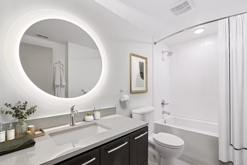 Luxurious bathroom with marble countertops and modern fixtures at Adaire Apartments