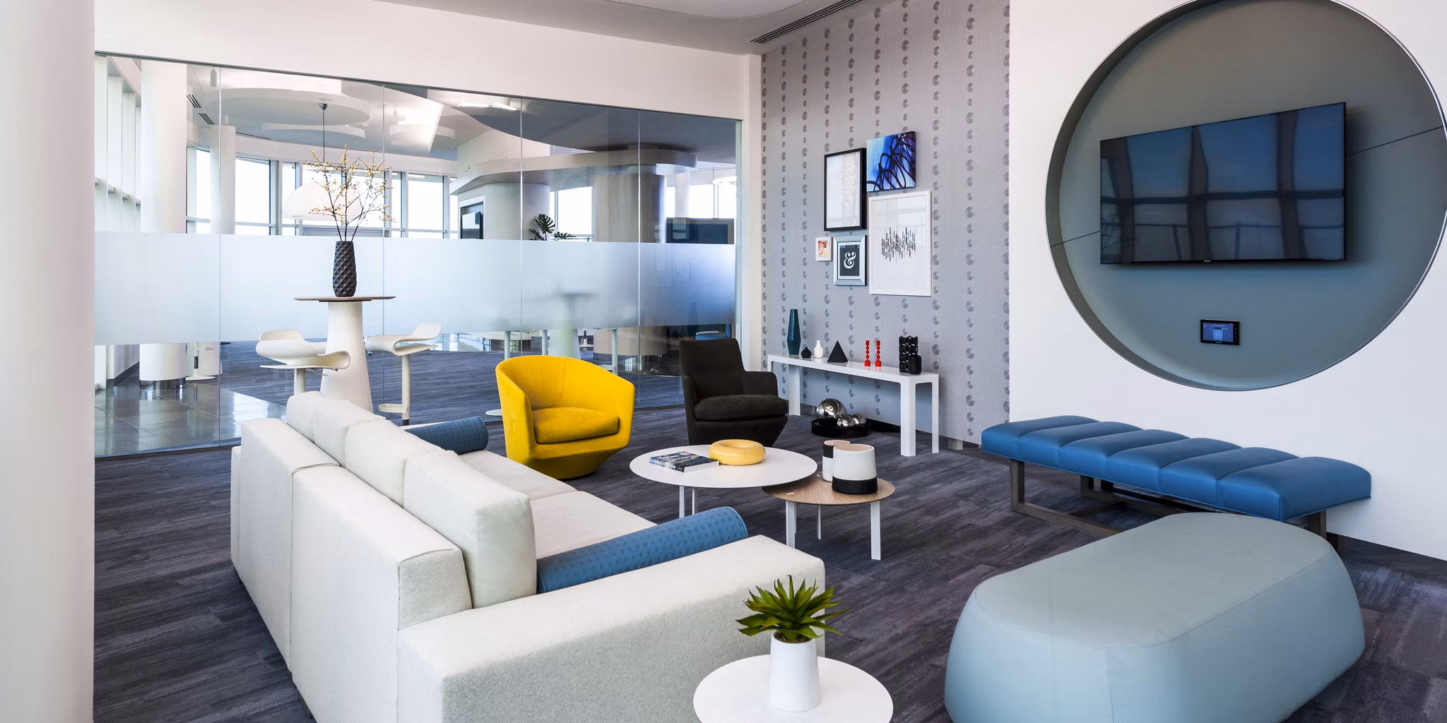 Clubhouse featuring modern design and social seating areas at Adaire Apartments
