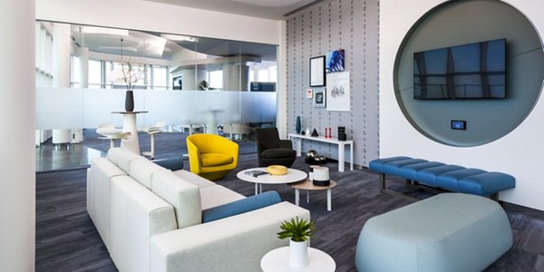 Clubhouse featuring modern design and social seating areas at Adaire Apartments