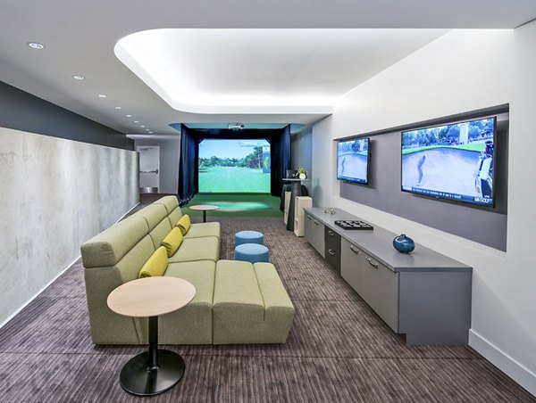 Indoor virtual driving range for golf enthusiasts at Adaire Apartments