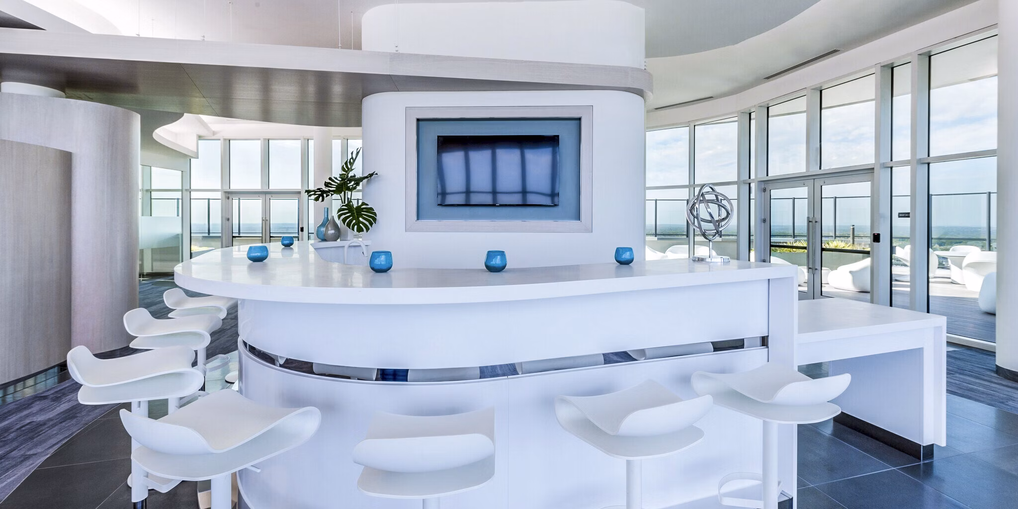 Clubhouse featuring modern design and ample seating at Adaire Apartments