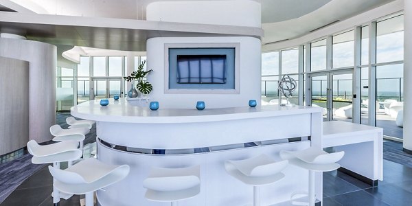 Clubhouse featuring modern design and ample seating at Adaire Apartments