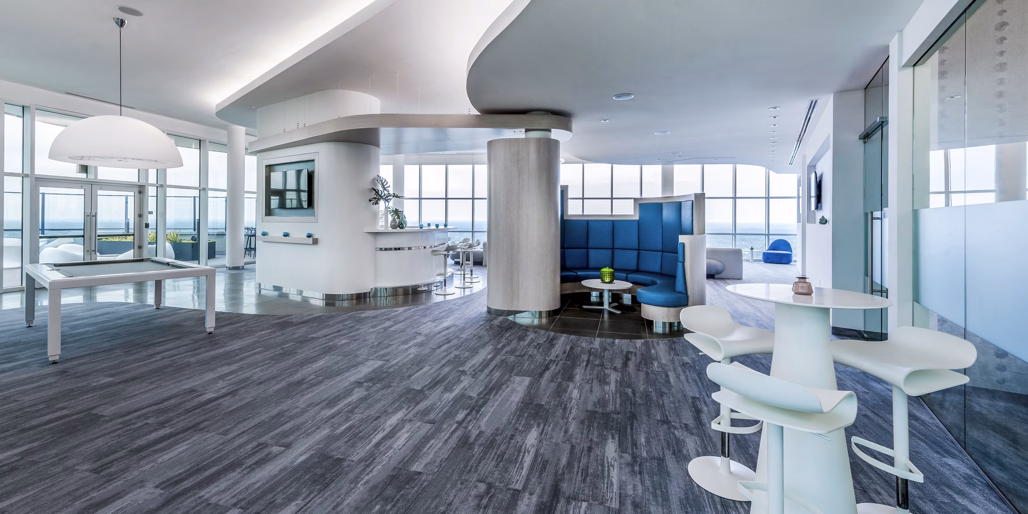 Modern clubhouse with comfy seating and billiards table at Adaire Apartments
