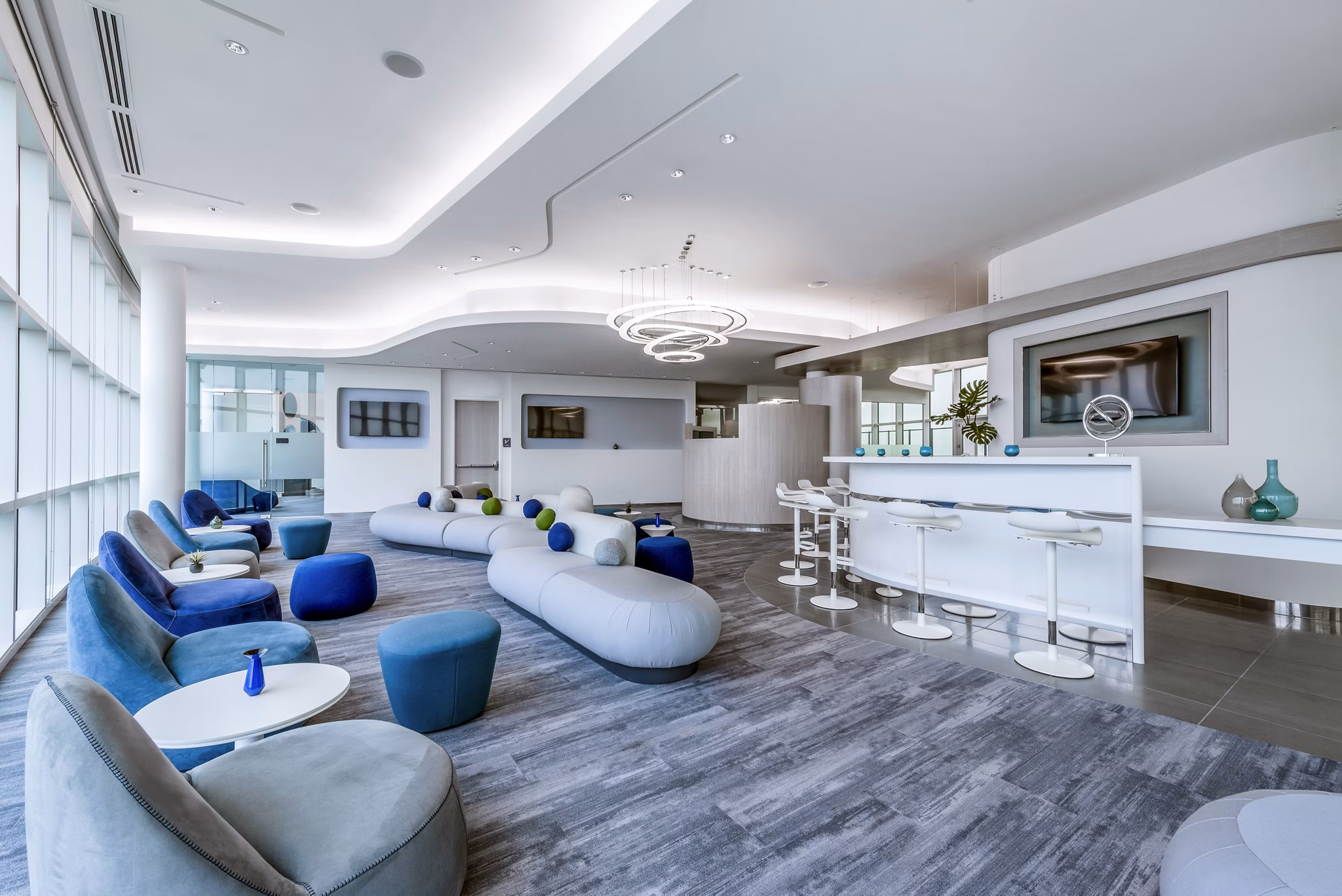 Elegant clubhouse featuring modern furnishings at Adaire Apartments, ideal for social gatherings and relaxation