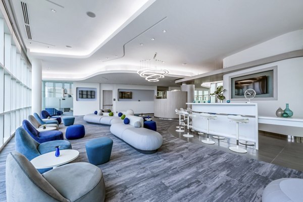 Elegant clubhouse featuring modern furnishings at Adaire Apartments, ideal for social gatherings and relaxation
