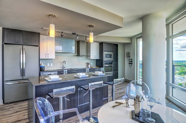 Dining area with elegant table setting and modern lighting at Adaire Apartments luxury property