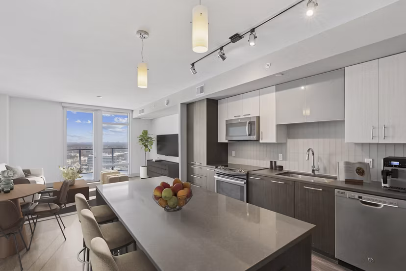 Modern kitchen with sleek countertops and stainless steel appliances at Adaire Apartments