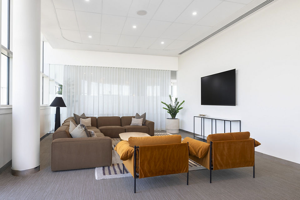 Spacious living room with modern decor at Adaire Apartments