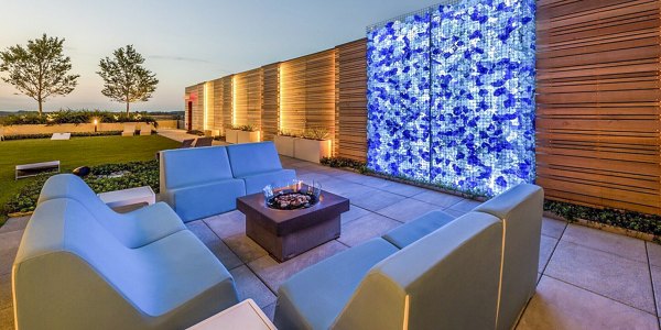 Cozy fire pit on an outdoor patio at Adaire Apartments, perfect for social gatherings in a luxury setting