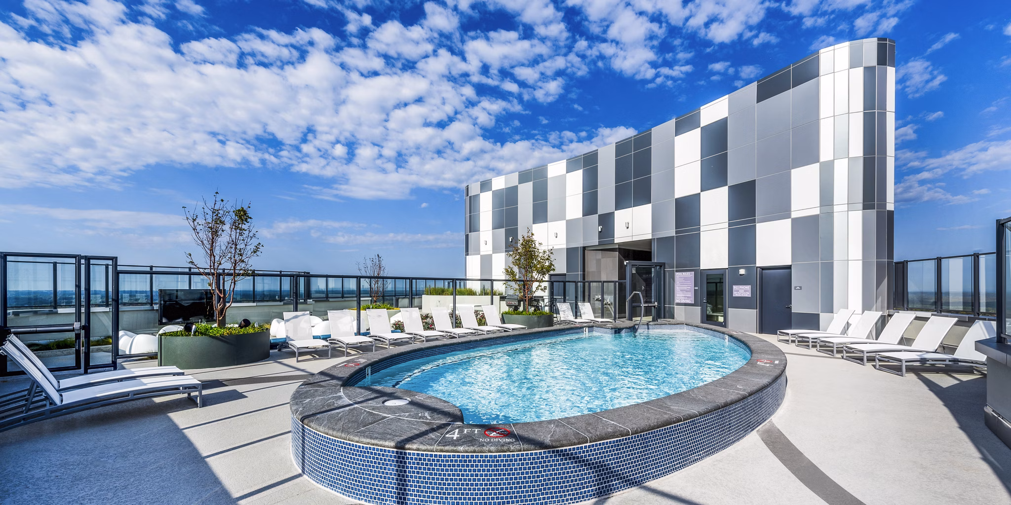 Stunning rooftop lounge with panoramic city views at Adaire luxury apartments, perfect for gatherings and relaxation