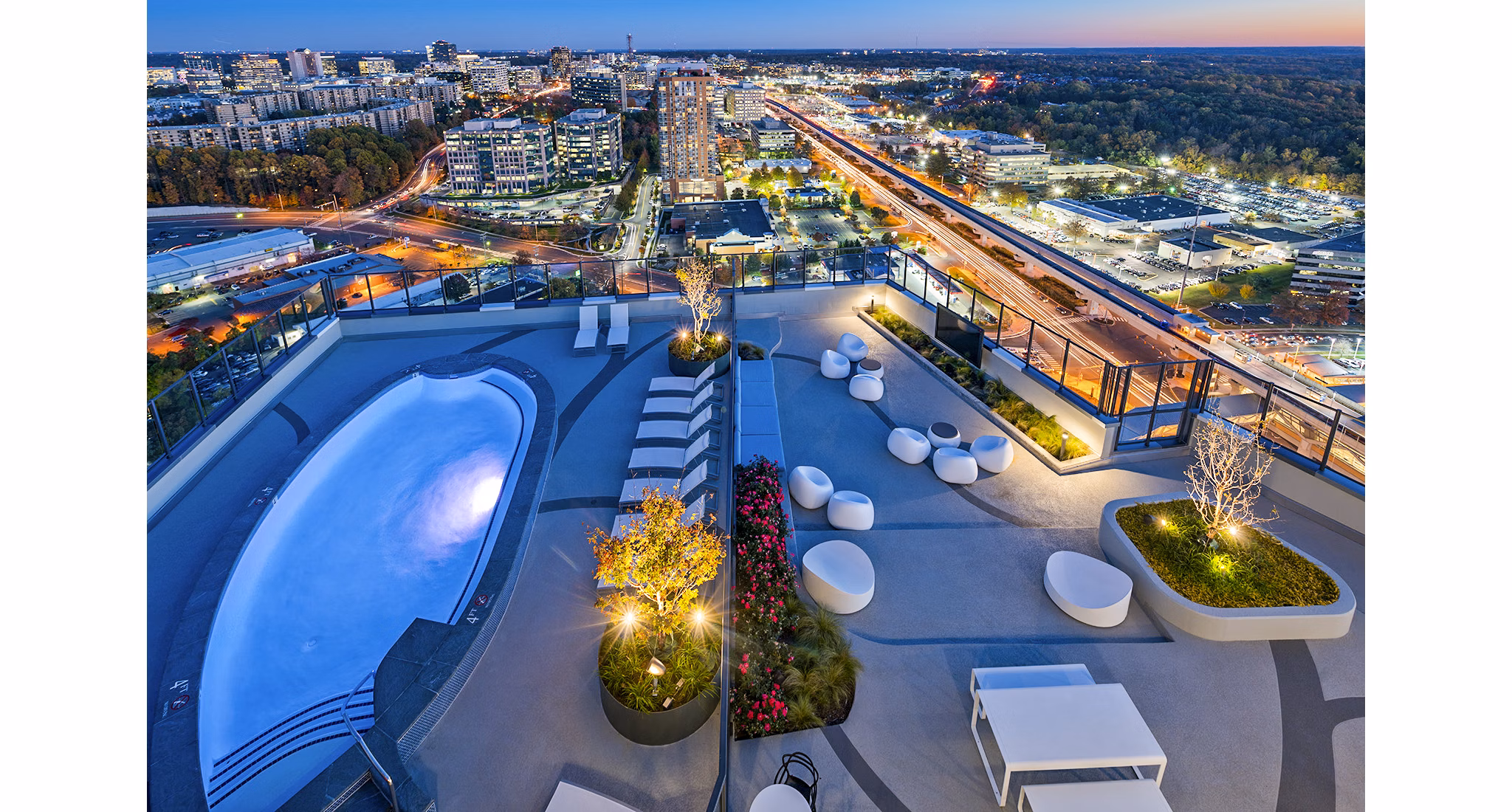 Luxurious pool area at Adaire Apartments offering relaxation and scenic views
